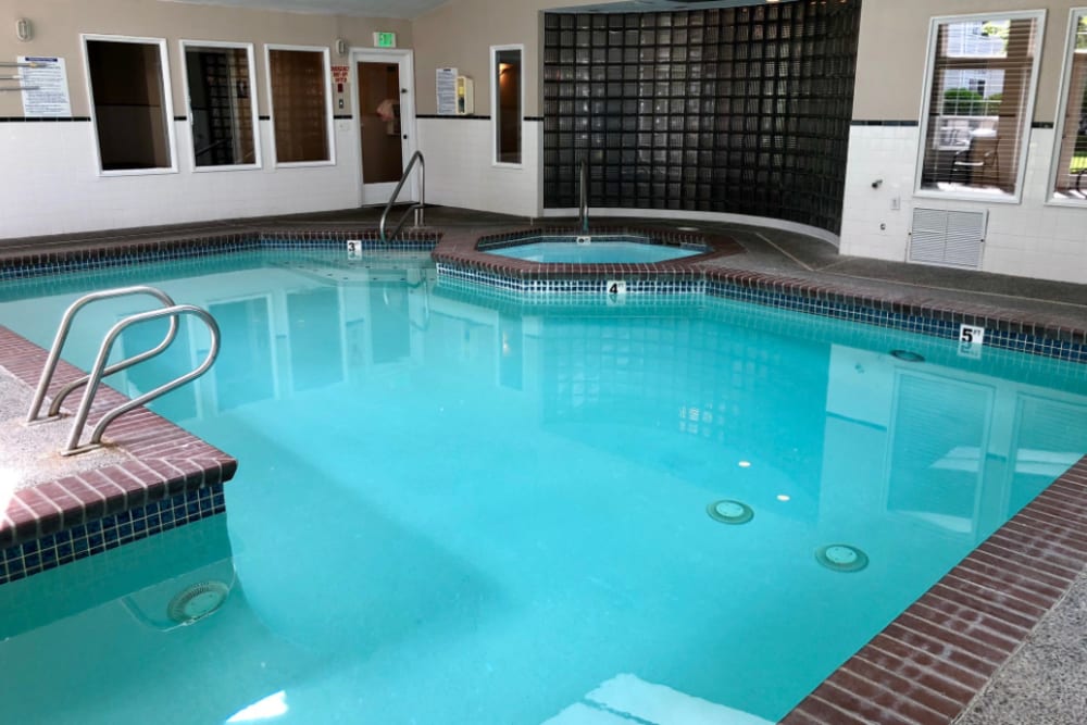 Indoor Pool Area With Clear Blue Water at Autumn Chase in Bothell, Washington