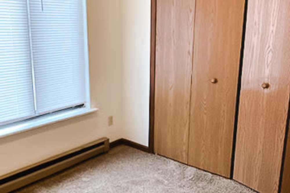 Bedroom with closet at West Elm Villas in Wauseon, Ohio