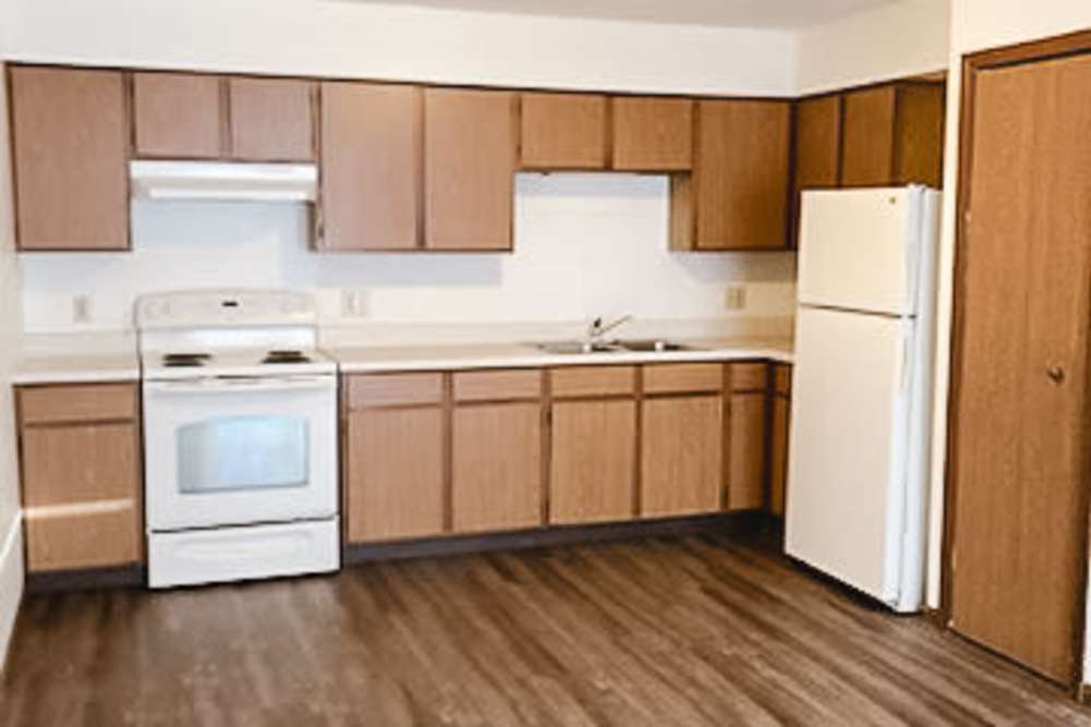 Kitchen with cabinets at West Elm Villas in Wauseon, Ohio