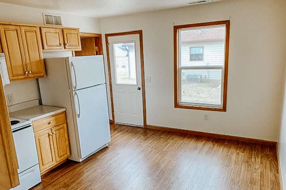 Kitchen with refrigerator and range at Riverside Villas in Columbia City, Indiana