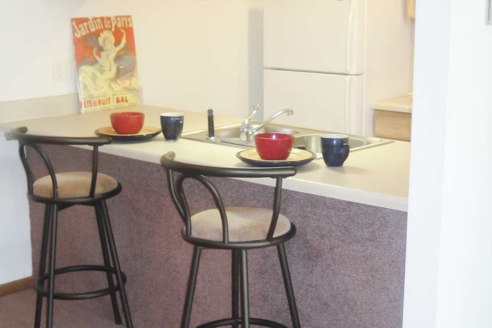 Fully-equipped kitchen at Maple Heights Apartments in Saline, Michigan