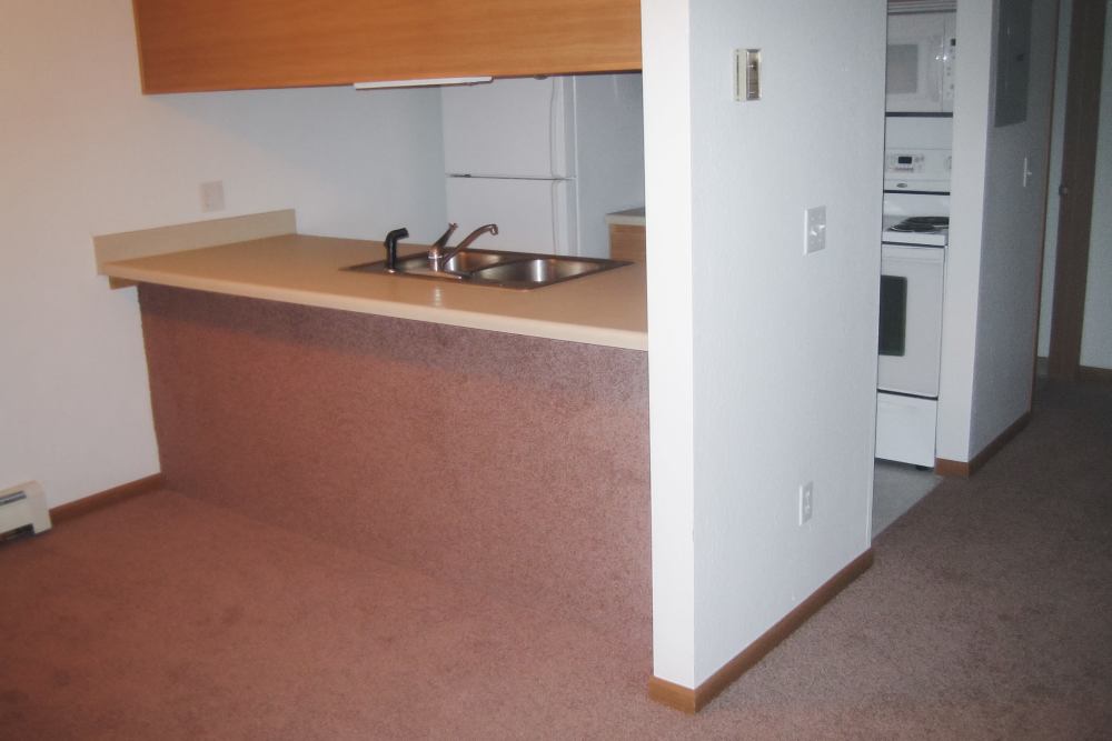 Comfortable kitchen at Maple Heights Apartments in Saline, Michigan