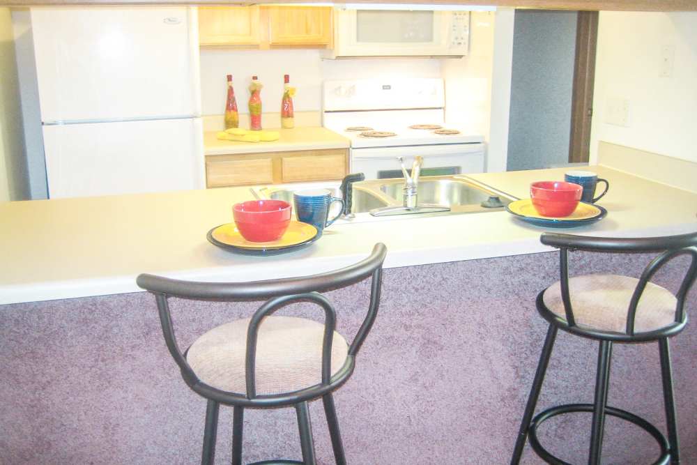 View of spacious apartment kitchen at Maple Heights Apartments in Saline, Michigan