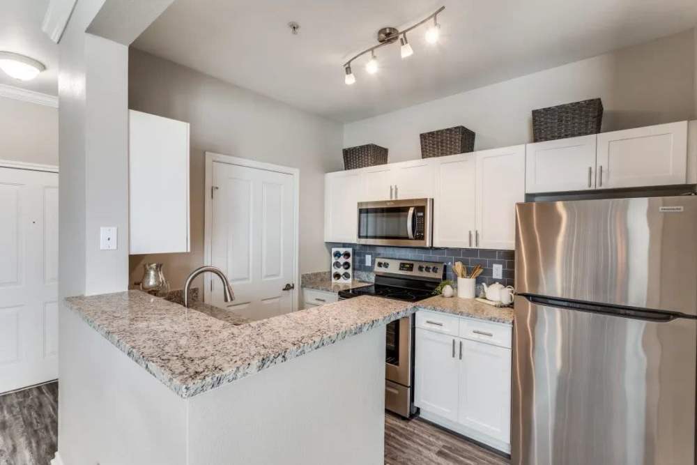 Apartment kitchen at Oakville Apartments in Austin, Texas