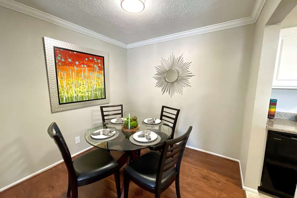 Dining room with table for four at The Abbey at Medical Center in San Antonio, Texas