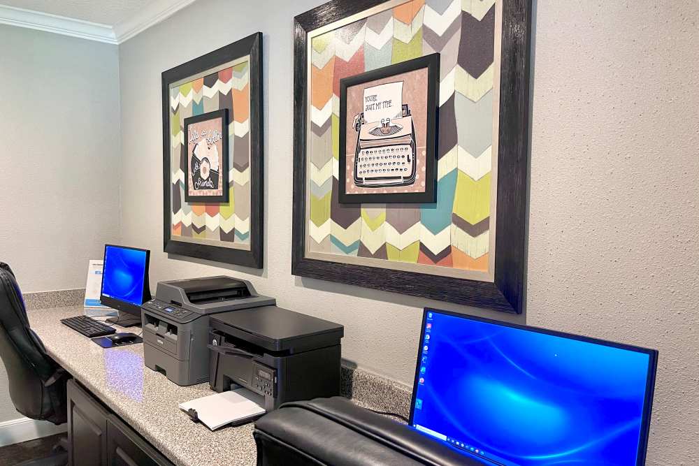 Business center with computers and copiers at The Abbey at Medical Center in San Antonio, Texas