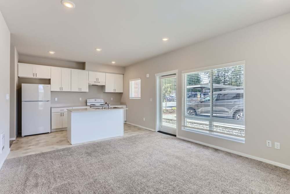 View of the bright kitchen from the living room at The Lookout in Everett, Washington