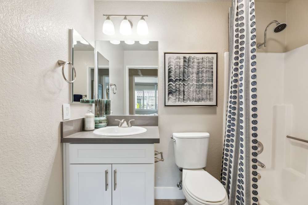 Bathroom Vanity With Bright Overhead Lights at Sofi at Wood Ranch in Simi Valley, California