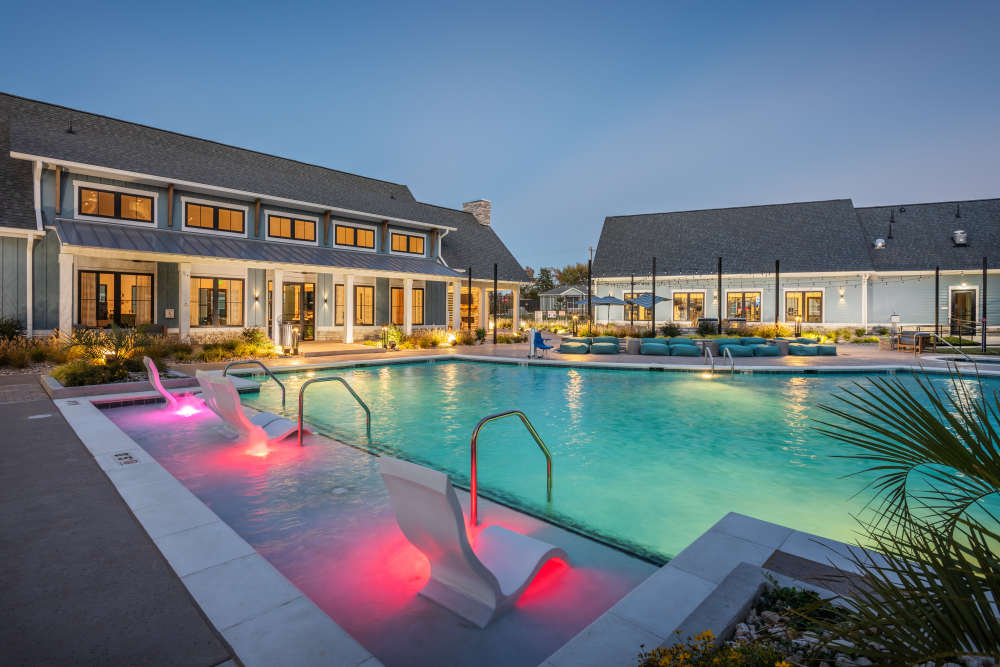 Luxurious swimming pool at night at Taylor Farms in Charlotte, North Carolina