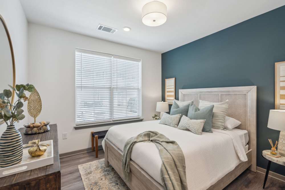 Cozy bedroom in a model home at Taylor Farms in Charlotte, North Carolina