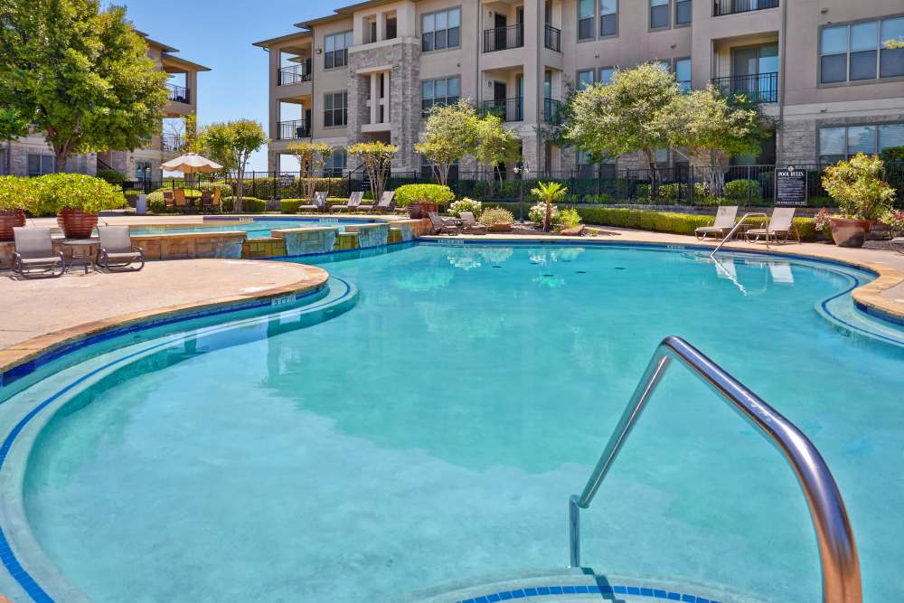 Sunny pool at Oakville Apartments in Austin, Texas