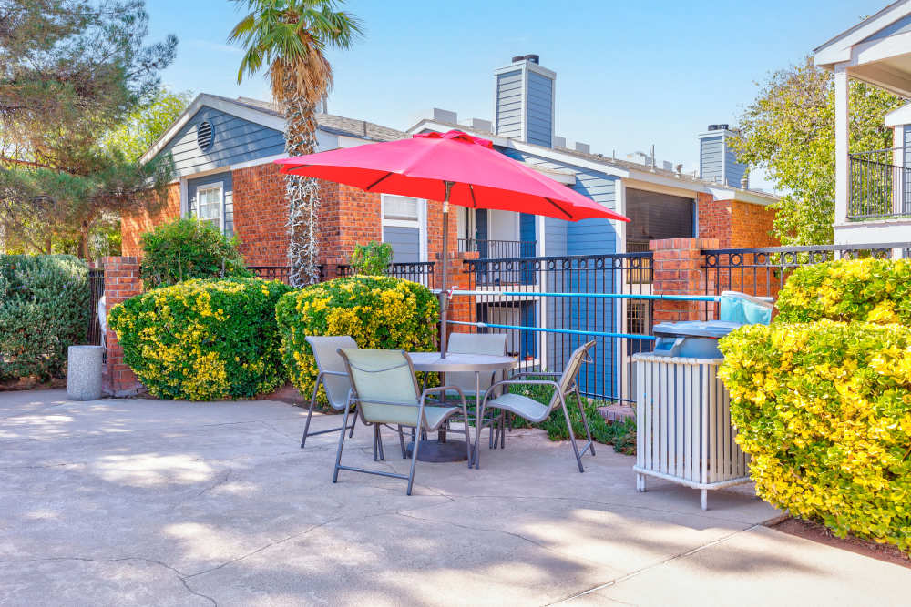 red umbrella with many seats