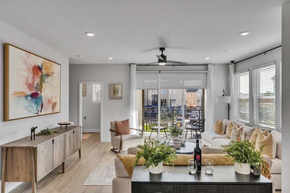 Living room featuring floor to ceiling windows & natural light 