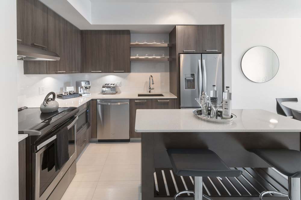 Kitchen with European-style cabinetry at Solitair Brickell Apartments in Miami, Florida