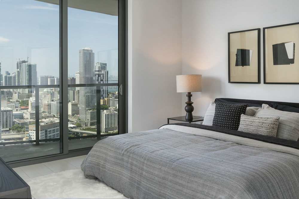Bedroom with a view and balcony access at Solitair Brickell Apartments in Miami, Florida