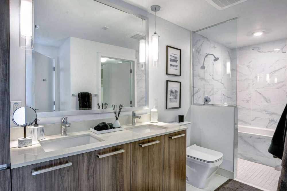 Bathroom with sleek stainless steel fixtures at Solitair Brickell Apartments in Miami, Florida