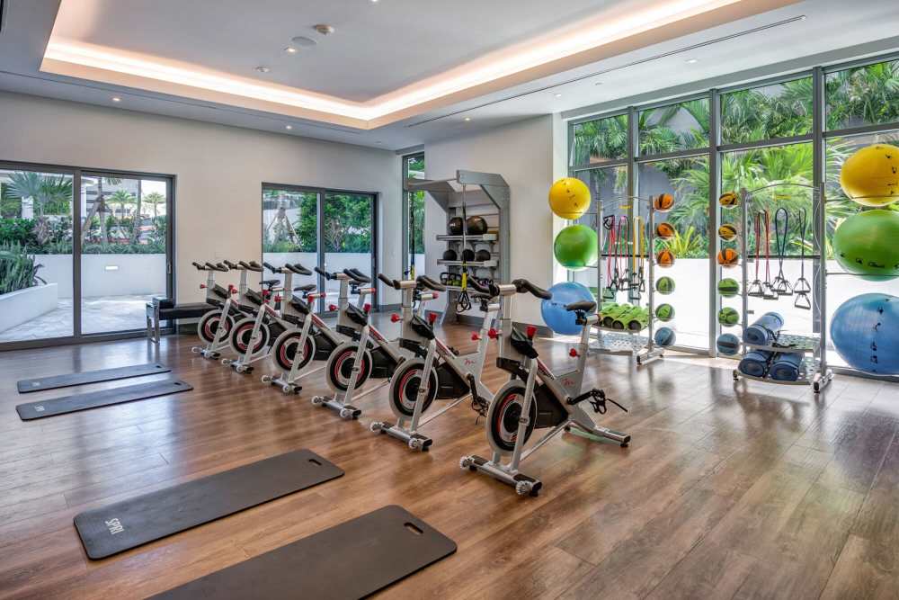 Indoor community fitness center with wide range of equipment at Solitair Brickell Apartments in Miami,Florida
