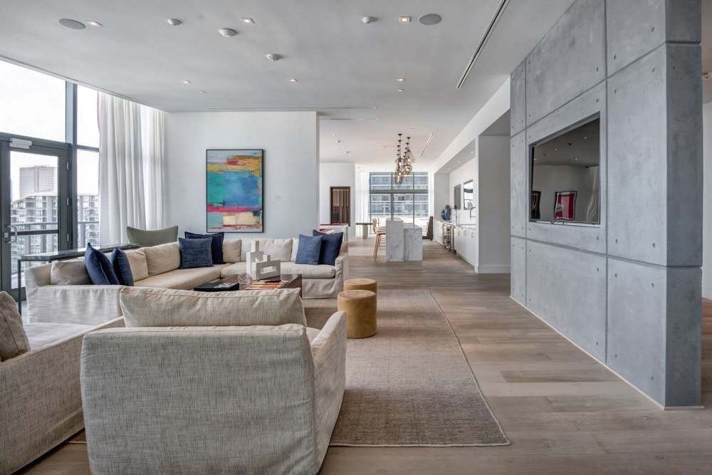Clubhouse lounge with TV at Solitair Brickell Apartments in Miami, Florida