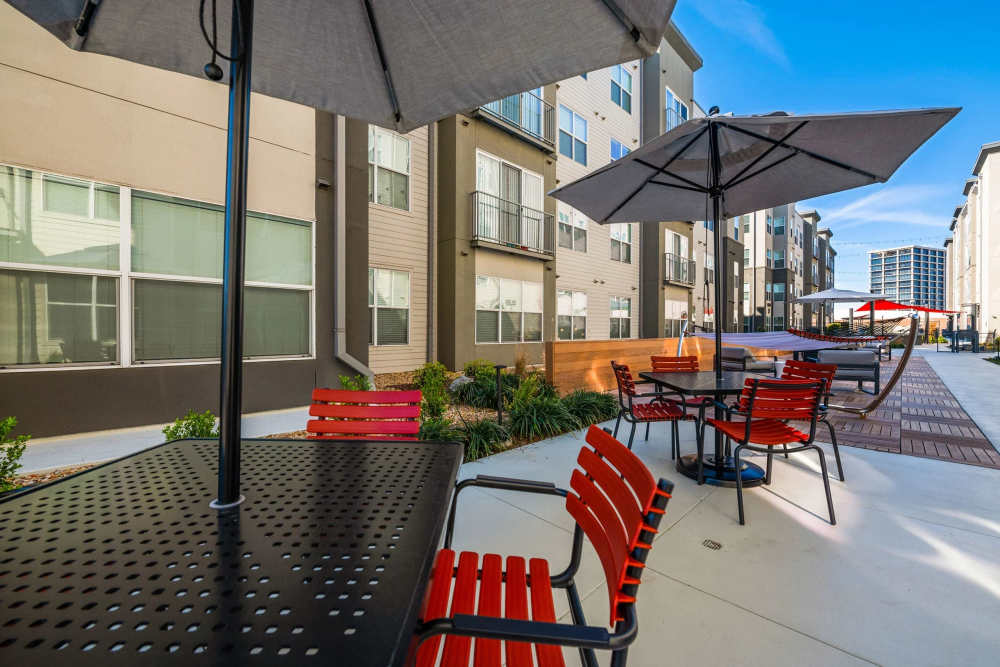covered patio seating and tables at Belclaire in Dallas, Texas