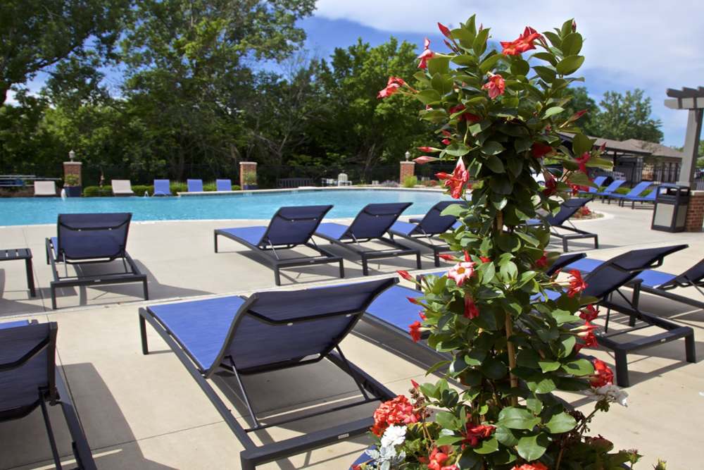 lounge chairs by pool at ((location_name}} in Kansas City, MO