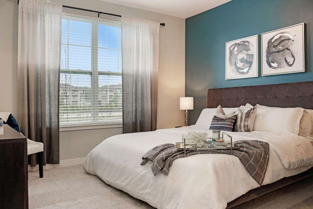 bedroom with blue wall at ((location_name}} in Avon, IN