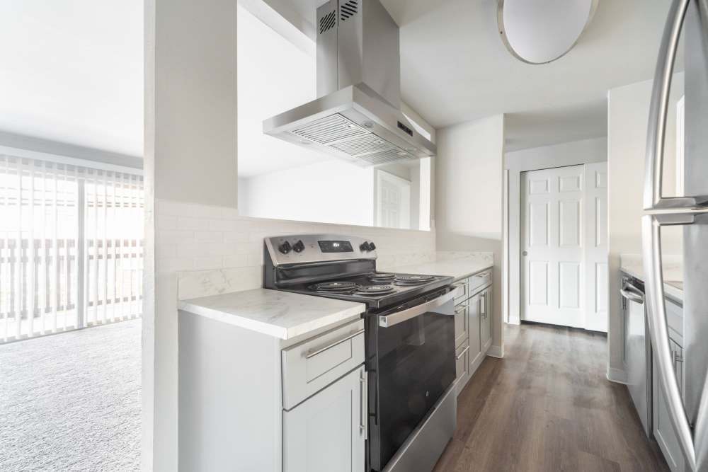 Modern kitchen with stainless-steel appliances at Lantera Apartments in Seattle, Washington