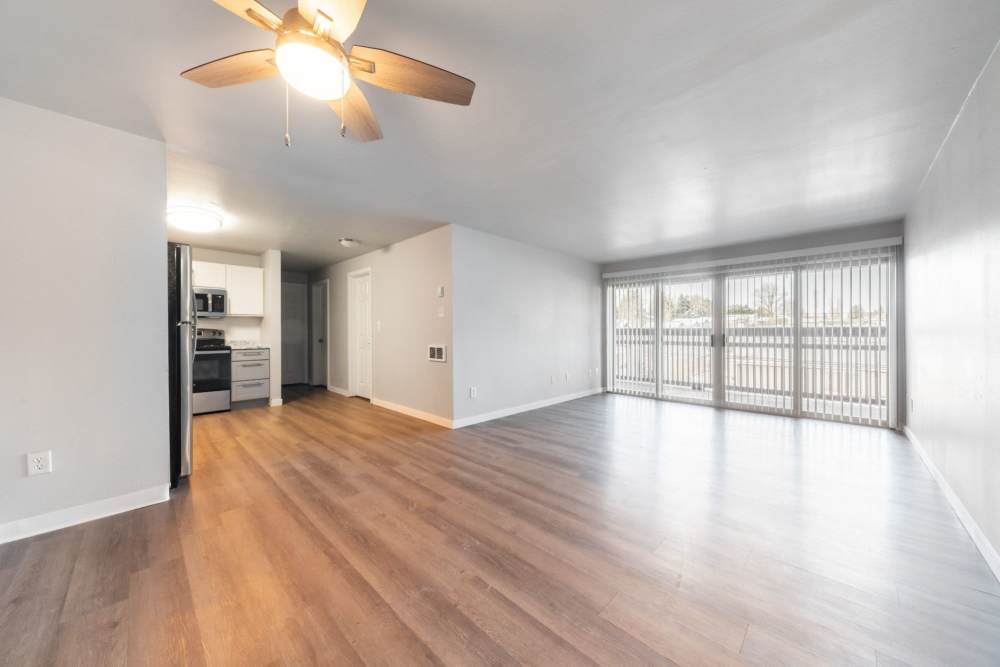 Bright, spacious living room with hardwood floors at Lantera Apartments in Seattle, Washington