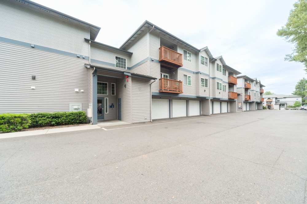 Exterior image showing the driveway and complex at Taylor Creek Apartments in Seattle,Washington