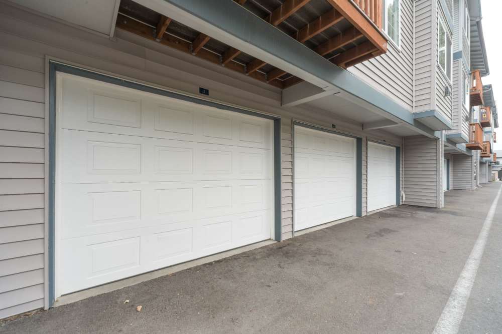 Parking garage with shutter doors at Taylor Creek Apartments in Seattle,Washington