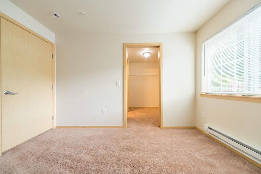 Empty bedroom with an attached bathroom at Taylor Creek Apartments in Seattle,Washington