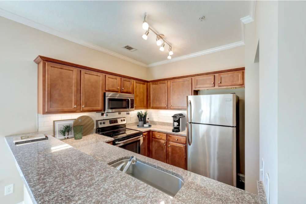 Kitchen with stainless steel appliances at Sage Creek Apartments in Augusta, Georgia