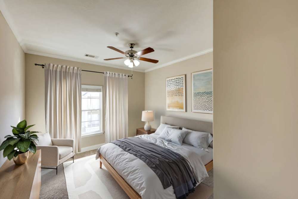 Bedroom with ceiling fan at Sage Creek Apartments in Augusta, Georgia