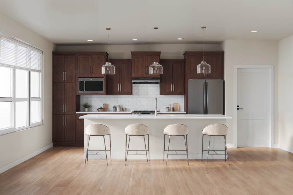 Elegant Dark Wood Kitchen With Modern Appliances at Amira Minnetonka in Minnetonka, Minnesota