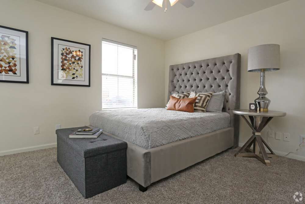 Comfortable bed in the bedroom at Woodforest Chase in Houston, Texas