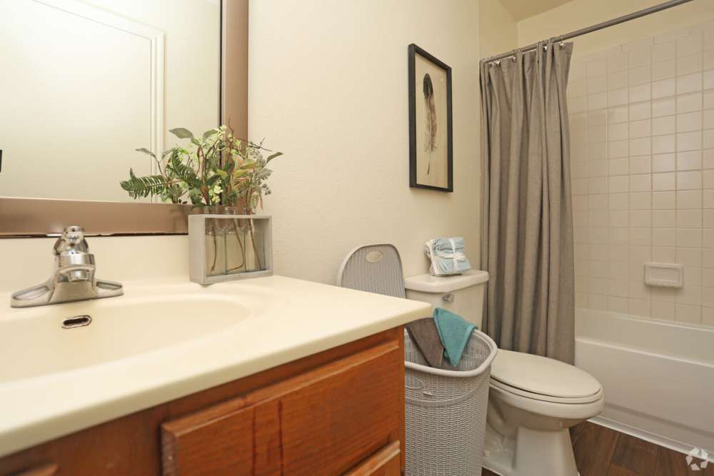 Bright bathroom with bath tub at Woodforest Chase in Houston, Texas