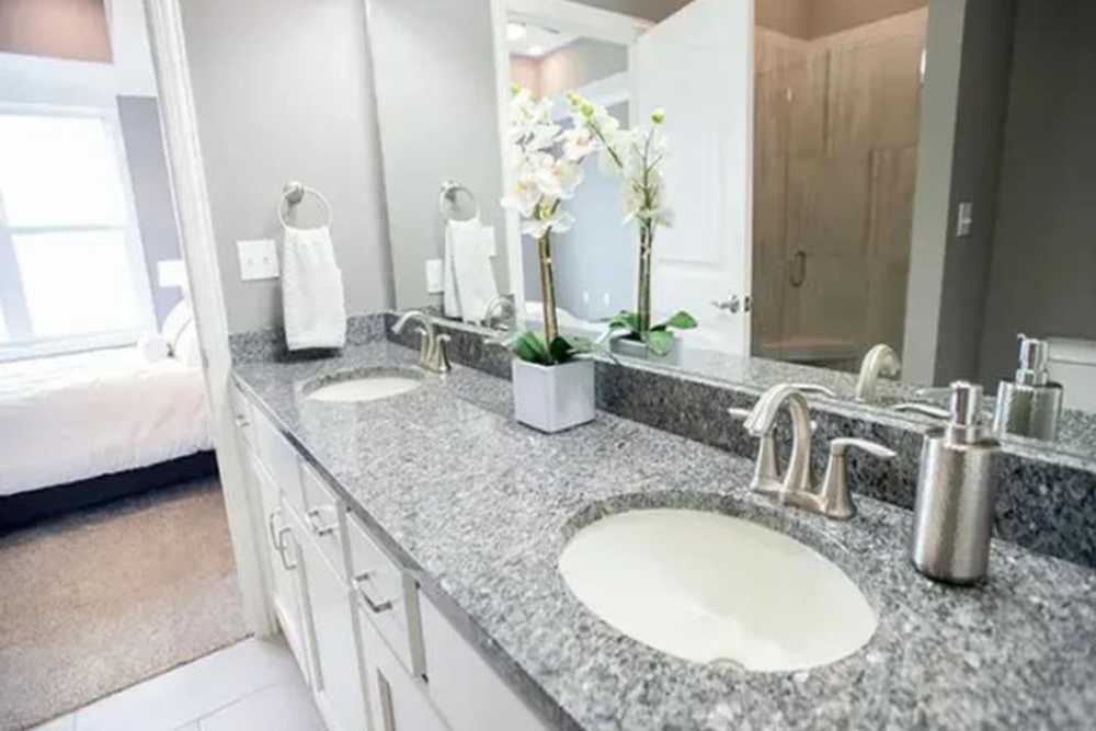 Large bathroom with vanity mirror at The Residences at Old Hawthorne in Columbia, Missouri