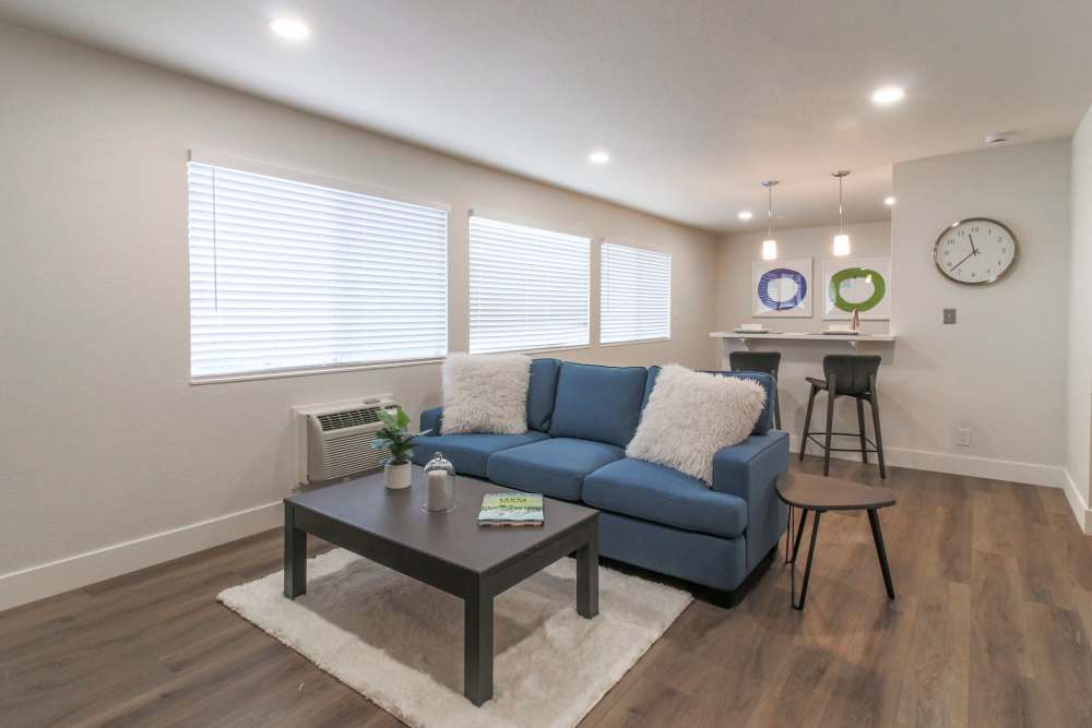 A modern kitchen featuring bar stools and a sleek refrigerator, creating a cozy dining space at Davis, California