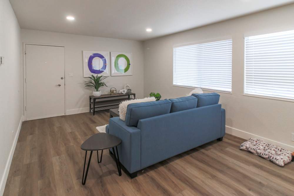 A modern kitchen featuring bar stools and a sleek refrigerator, creating a cozy dining space at Davis, California