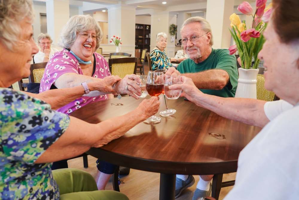 Residents toasting at Harmony at Eagles Landing in McDonough, Georgia