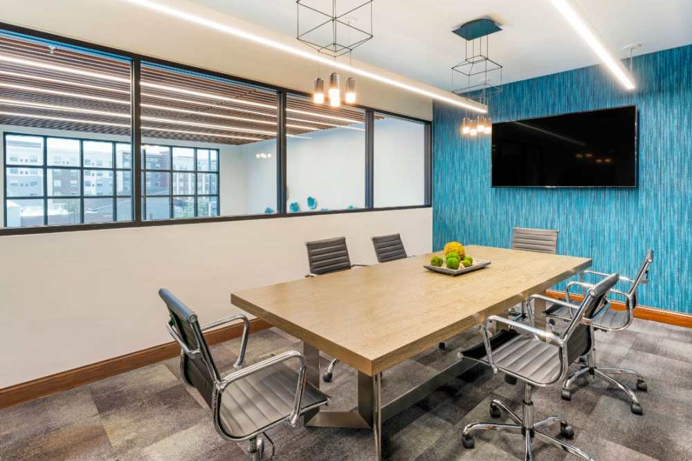 conference room with TV at The Mark at Fishers District in Fishers, Indiana