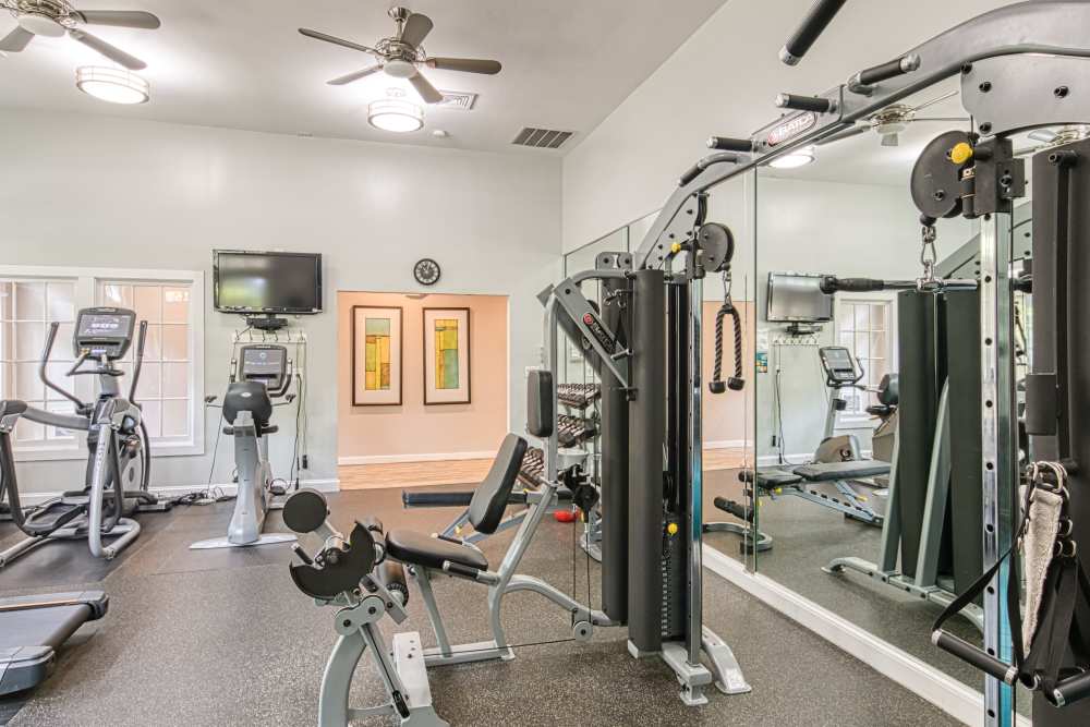 Fitness center with treadmills, and multiple windows at Beacon Place at Kentlands in Gaithersburg, Maryland  
