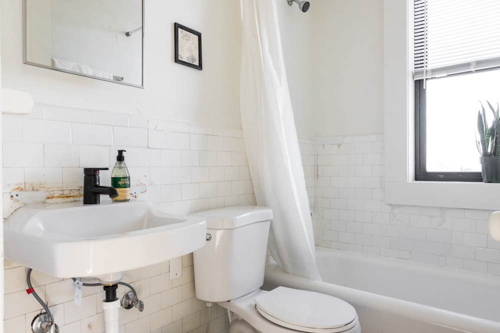 Bathroom with bathtub at Detroit Living in Detroit, Michigan