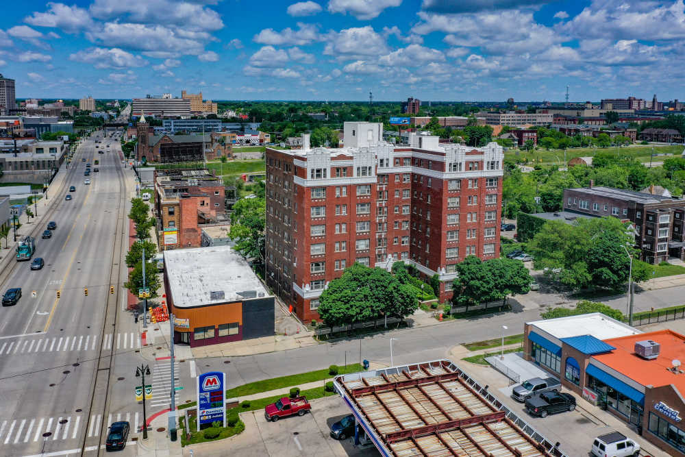 Front entrance with parking lot at Detroit Living in Detroit, Michigan