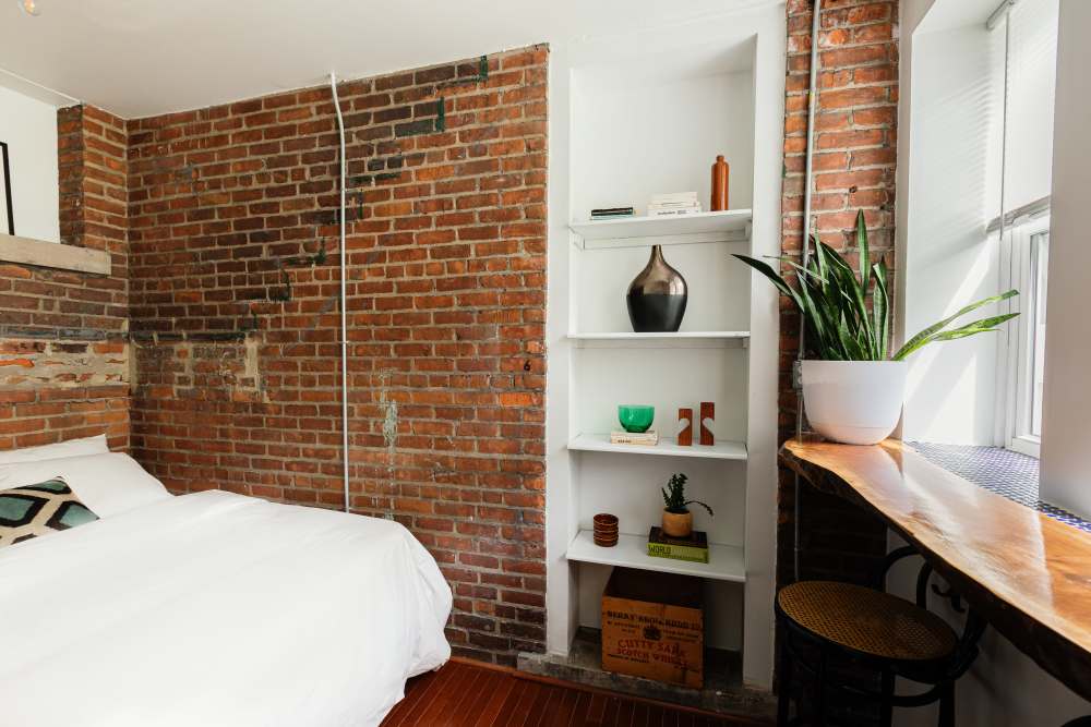 Well-lit bedroom at Detroit Living in Detroit, Michigan