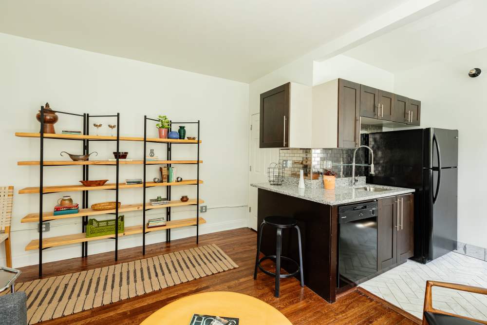 View of living room and kitchen at Detroit Living in Detroit, Michigan