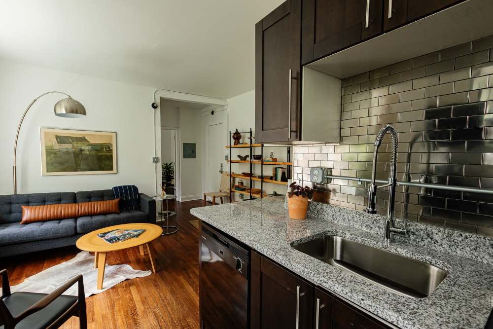 Kitchen with black oven at Detroit Living in Detroit, Michigan