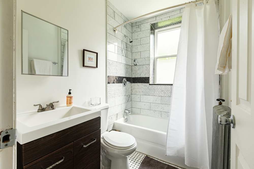 Bright bathroom with tub at Detroit Living in Detroit, Michiganat