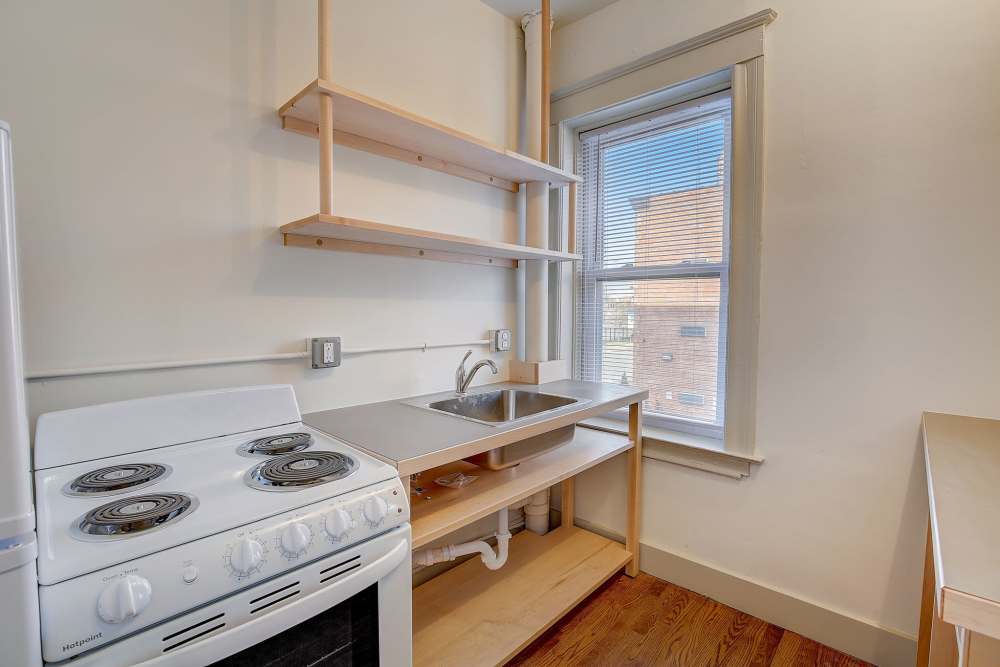 Fully-equipped kitchen with oven at Detroit Living in Detroit, Michigan