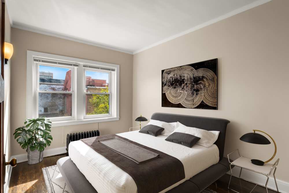 Well-lit and spacious bedroom at Detroit Living in Detroit, Michigan