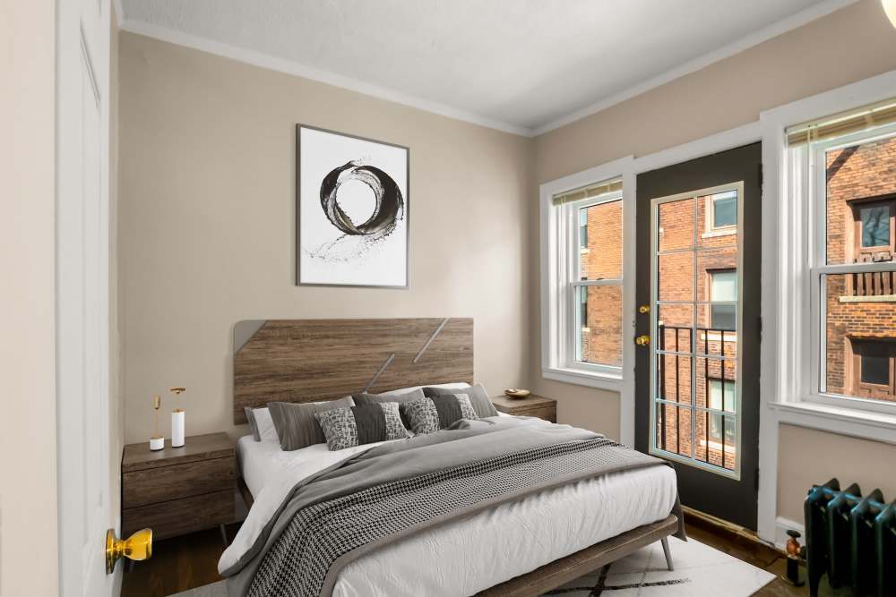 Cozy bedroom with patio at Detroit Living in Detroit, Michigan